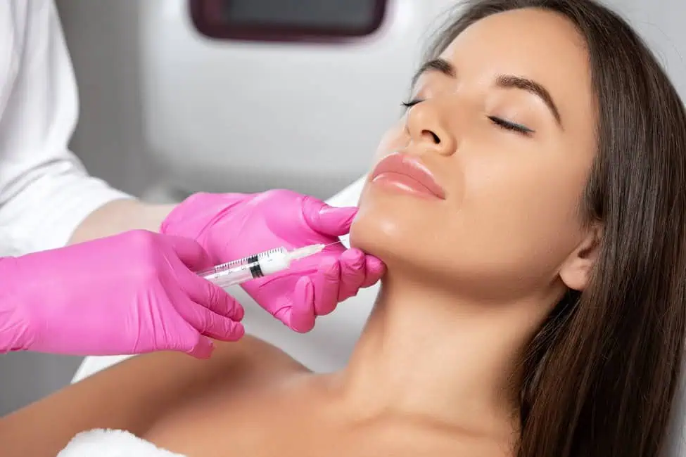 Nurse injector injecting a women with kybella injection in Charlotte, NC
